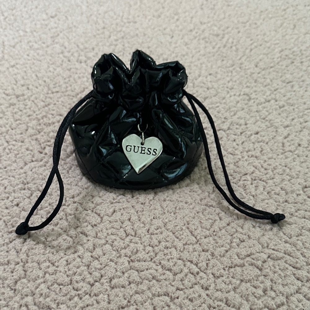 Guess Shiny Black Drawstring Bag with Heart Charm used but good condition
